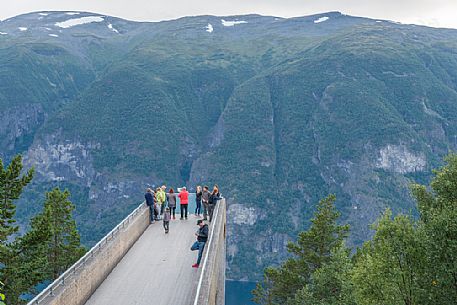 Tourists at the Stegastein looking the Aurlandfjord near Aurland, Sognefjord, Norway