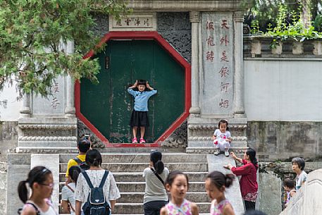 Tourists at the Beihai Park, the imperial garden to the north-west of the Forbidden City in Beijing, China