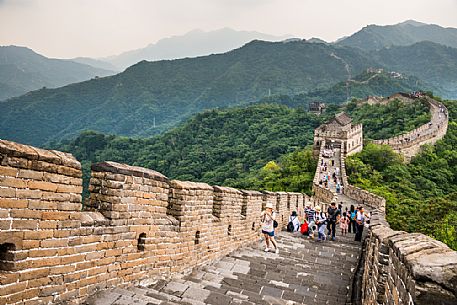 Tourists at the great wall in the Mutianyu village section, Beijing, China Tourists at the great wall in the Mutianyu village section, Beijing, China
