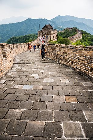 Tourists at the great wall in the Mutianyu village section, Beijing, China Tourists at the great wall in the Mutianyu village section, Beijing, China