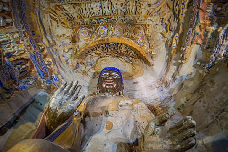 The beautiful ancient remains of Buddha Statue in Yungang Grottoes, Datong, Shanxi Province, China The beautiful ancient remains of Buddha Statue in Yungang Grottoes, Datong, Shanxi Province, China