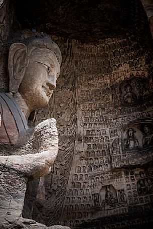 The beautiful ancient remains of Buddha Statue in Yungang Grottoes, Datong, Shanxi Province, China The beautiful ancient remains of Buddha Statue in Yungang Grottoes, Datong, Shanxi Province, China