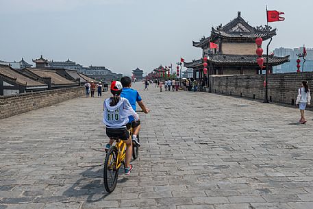 Pedaling along the ancient city wall, Xi'An, Shanxi, China