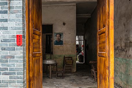 Typical chinese house with Mao Zedong portrain in the wall, Beijing, China