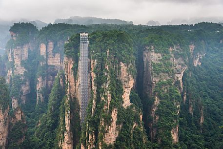 Hallelujah mountains or Avatar mountains ant the Bailong Elevator in the fog, Zhangjiajie National Forest Park, Hunan, China