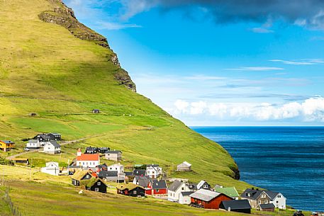 The iconic village of Mikladalur, Kalsoy Island, Faeroe Islands, Denmark, Europe The iconic village of Mikladalur, Kalsoy Island, Faeroe Islands, Denmark, Europe