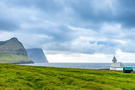Lonely church near Višareiši village, Viooy island, Faeroe islands, Denmark, Europe Lonely church near Višareiši village, Viooy island, Faeroe islands, Denmark, Europe