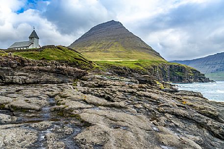 Lonely church near Viareii village, Viooy island, Faeroe islands, Denmark, Europe