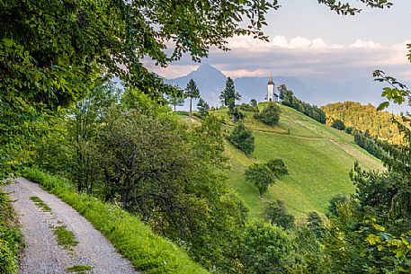 Saints Primus and Felician Church near Jamnik and Kroper with Storzic mountain in the background, Kranj, Upper Carniola, Slovenia, Europe Saints Primus and Felician Church near Jamnik and Kroper with Storzic mountain in the background, Kranj, Upper Carniola, Slovenia, Europe