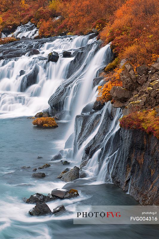 Hraunfossar waterfall in warm autumn colors