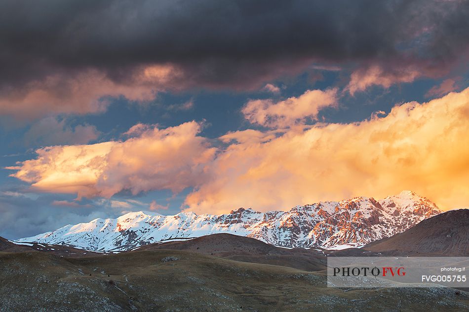 A sunset clouds adorned sky above Mount Prena. Below the mountain the grasslands of Campo Imperatore, Gran Sasso national park