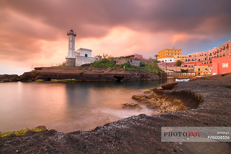 The old Ventotene Lighthouse built over the roman harbor at sunrise