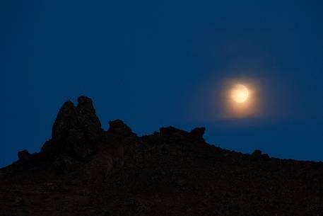 Moon rising from lava field in the Aldeyjarfoss waterfall area