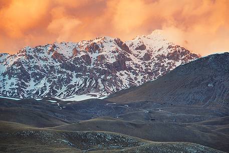 A sunset clouds adorned sky above Mount Prena. Below the mountain the grasslands of Campo Imperatore, Gran Sasso national park.