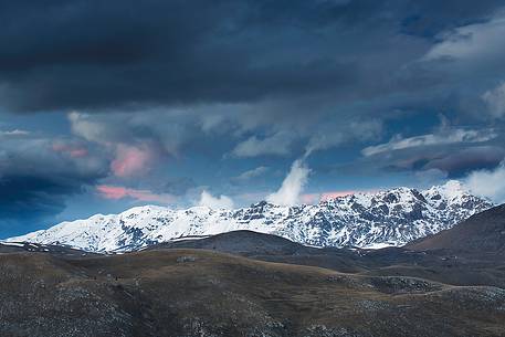 Twilight clouds above Mount Prena after sunset. Below the mountain the grasslands of Campo Imperatore.