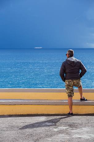 man watching a distant ship in Ventotene