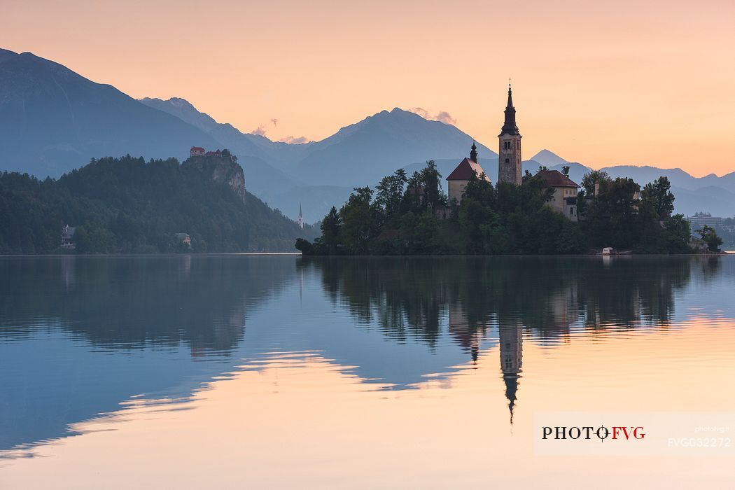 Bled Island with the Church of the Assumption and Julian Alps in the background at the sunrise, Bled lake, Slovenia