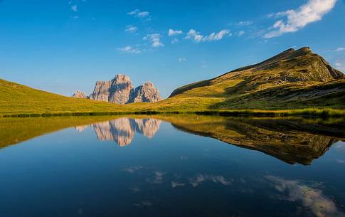 Mount Pelmo is reflected on the lake of the Baste, Mondeval, dolomites, Italy