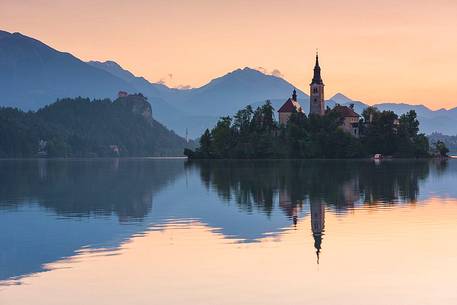 Bled Island with the Church of the Assumption and Julian Alps in the background at the sunrise, Bled lake, Slovenia