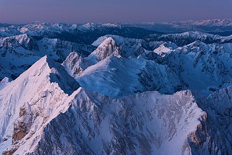 Sunrise from Punta Penia in the Marmolada mountain group, the highest peak of Dolomites, Italy