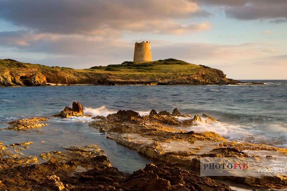 The ancient Sapnish watchtower of Piscinn. One of the hundreds that can be found in Sardinia. Here photographed at sunset.