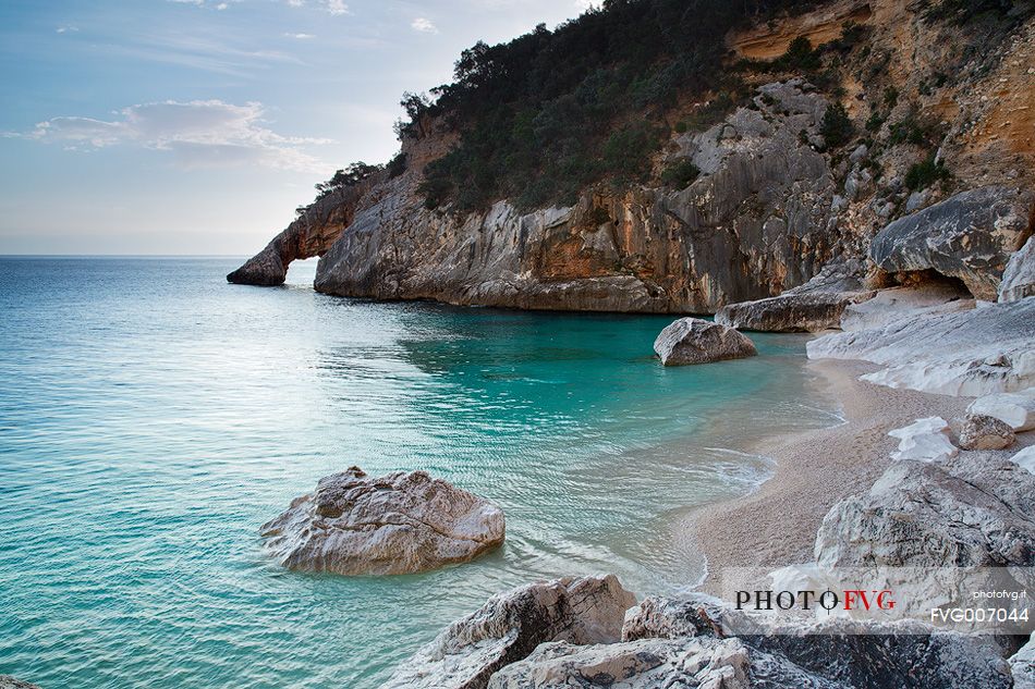 The beach, one of the most picturesque bay in Sardinia, founded by a landslide in 1962, is famous for its high pinnacle 143 feet above the creek, another characteristic feature of the beach is the natural arch that opens on the right side of the bay.