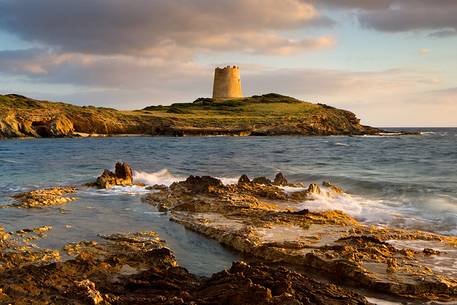 The ancient Sapnish watchtower of Piscinn. One of the hundreds that can be found in Sardinia. Here photographed at sunset.