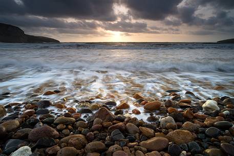 St. Catherine of Pittinurri and its pebble beach in the village.