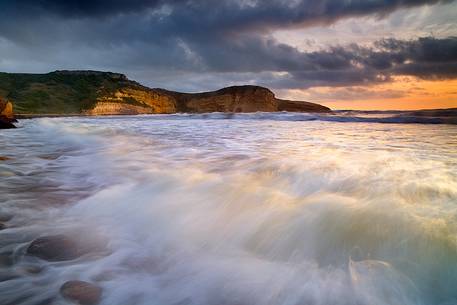 A wave of water and light, breaks in the beach of Santa Caterina di Pittinuri