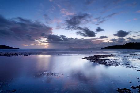 The Piscinn beach on the southwest coast of Sardinia after a heavy storm, taken at sunset blue hour, Sulcis-Iglesiente,