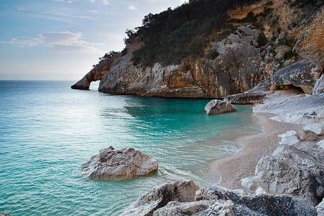 The beach, one of the most picturesque bay in Sardinia, founded by a landslide in 1962, is famous for its high pinnacle 143 feet above the creek, another characteristic feature of the beach is the natural arch that opens on the right side of the bay.
