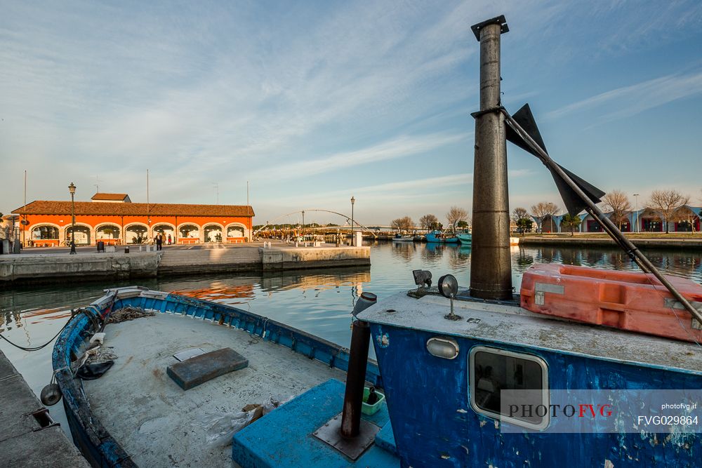 Fishing boats moored in the port of Marano Lagunare village, Friuli Venezia Giulia, Italy