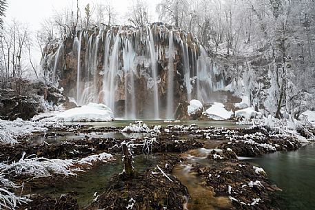 Winter waterfall in Plitvice Lakes National Park, Lika-Senj County, Karlovac County, Croatia.