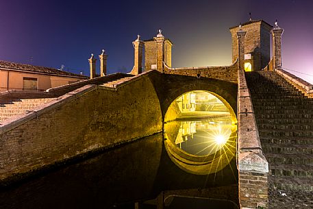 Details and reflections of Triple bridge, Ponte dei Trepponti bridge, called Ponte Pallotta, Comacchio town, Ferrara, Emilia Romagna, Italy