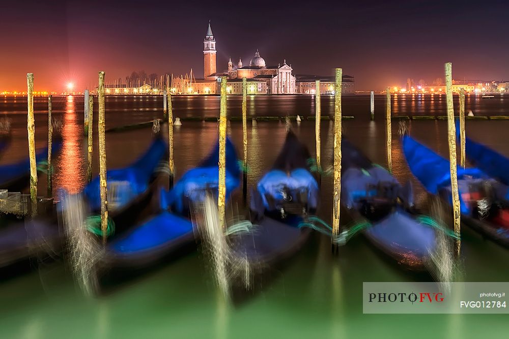 Gondolas near San Marco's square by night, in the background the San Giorgio Maggiore Basilica, Venice, Veneto, Italy, Europe