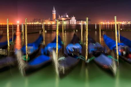 Gondolas near San Marco's square by night, in the background the San Giorgio Maggiore Basilica, Venice, Veneto, Italy, Europe