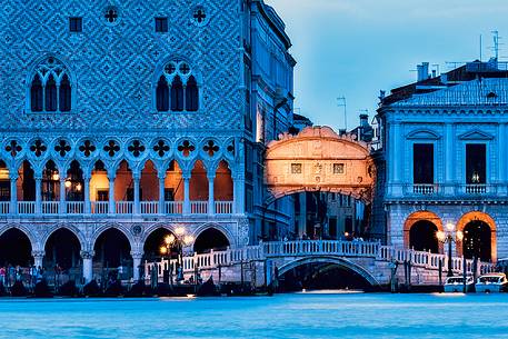 View of Bridge of Sighs or Ponte dei Sospiri illuminated at twilight and Palazzo Ducale, Venice, Italy, Europe