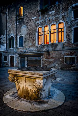 Typical well in a small square at twilight in Venice, Veneto, Italy, Europe