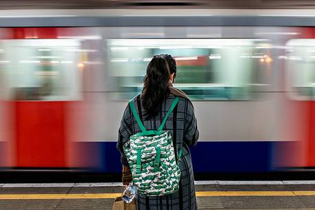 Girl waiting for the metro, London, England, United Kingdom, Europe