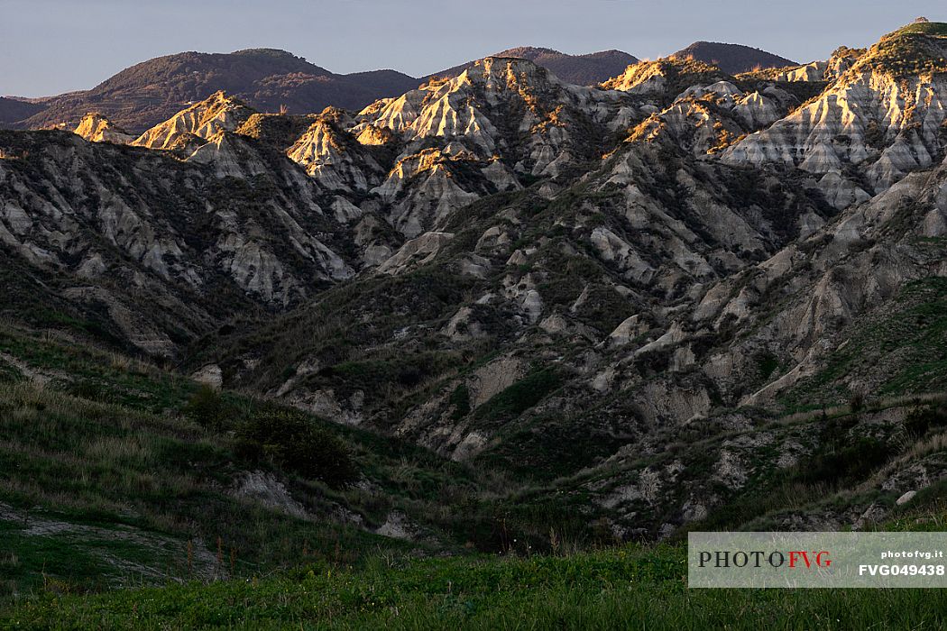 Badlands near Roccella Ionica, illuminated by the last rays of the sunset, Calabria