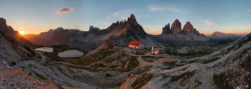 Panoramic view of the Tre Cime di Lavaredo, the Piani lake and the Locatelli refuge at dawn, Sexten dolomites, South Tyrol, Italy, Europe
