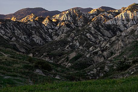 Badlands near Roccella Ionica, illuminated by the last rays of the sunset, Calabria