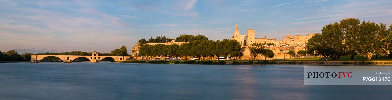 The city of Avignon across the Rhone River. The historic bridge of Avignon, Pont Saint-Benezet.