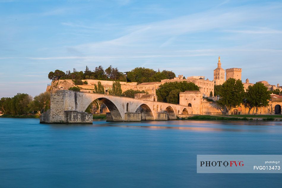 The city of Avignon across the Rhone River. The historic bridge of Avignon, Pont Saint-Benezet.