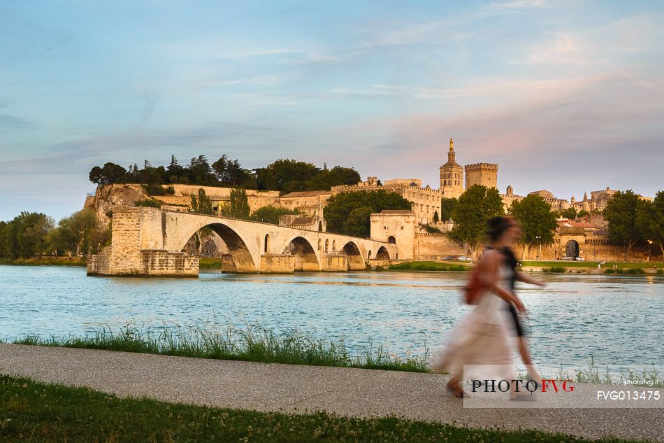 The city of Avignon across the Rhone River. The historic bridge of Avignon, Pont Saint-Benezet.