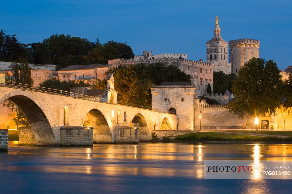 The city of Avignon across the Rhone River. The historic bridge of Avignon, Pont Saint-Benezet.