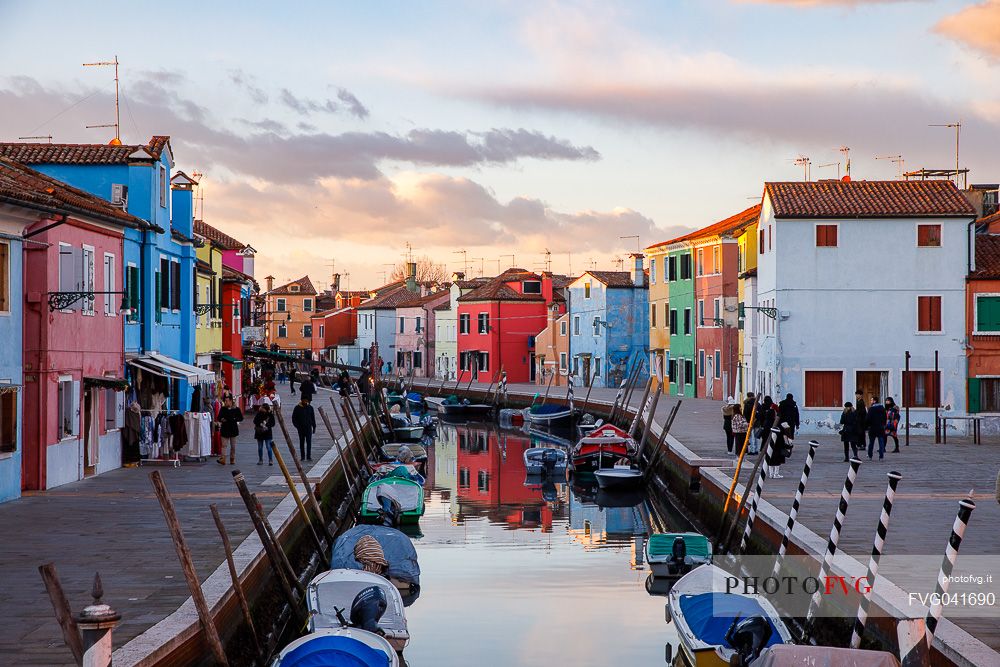 Colorful houses in Burano with canal and moored boast, Venice, Venetian lagoon, Veneto, Italy, Europe