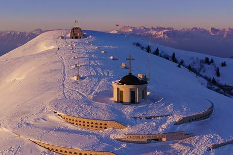 Aerial view of Ossuary to the fallen of Cima Grappa in the depths of winter at sunset