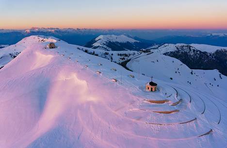 Aerial view of the ossuary to the fallen of Cima Grappa in the depths of winter at sunset