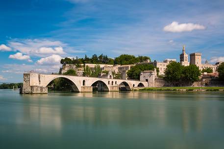 The city of Avignon across the Rhone River. The historic bridge of Avignon, Pont Saint-Benezet.